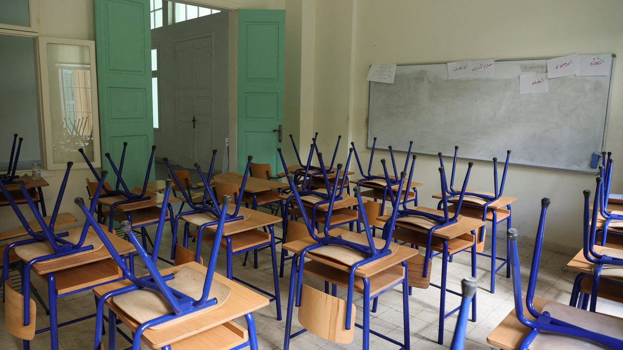 Chairs are placed on classroom tables at a closed public school in Beirut بيان دعماً للتعليم الرسمي وأساتذته، وحمايته من الضغوطات المشبوهة