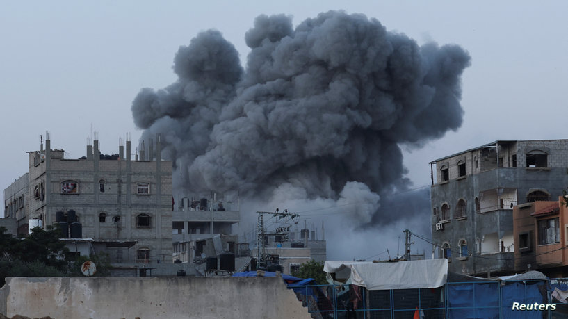 Smoke rises during an Israeli air strike in central Gaza Strip