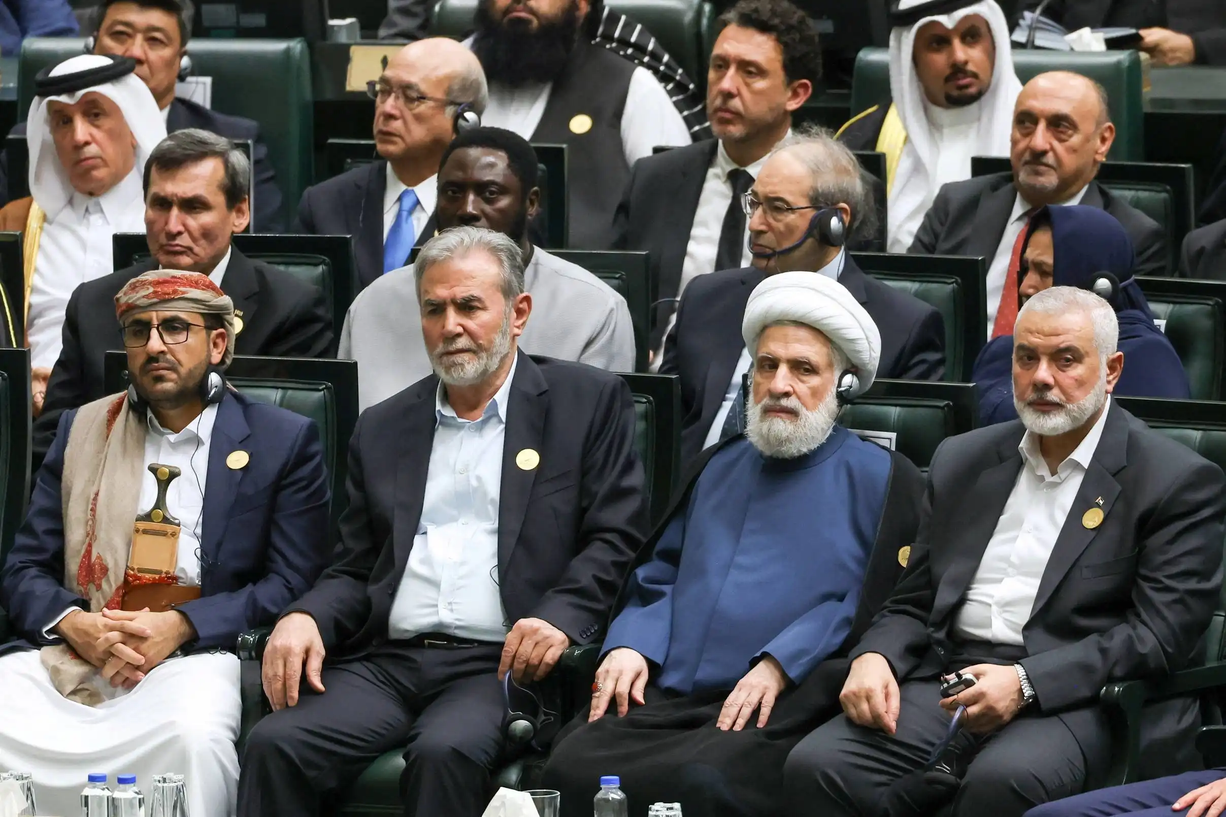 Palestinian Islamic Jihad chief Ziad al-Nakhala and Palestinian group Hamas’ top leader Ismail Haniyeh attend Iran’s new President Masoud Pezeshkian’s swearing-in ceremony at the parliament in Tehran ايران هنية نعيم قاسم