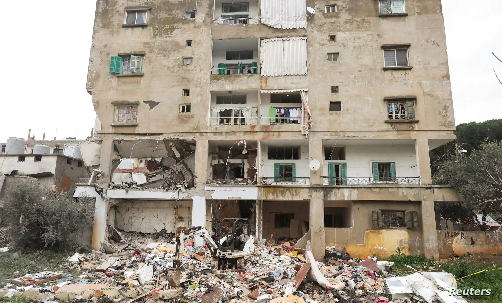 Debris is seen near a damaged building of what security sources said was an Israeli strike in Nabatieh