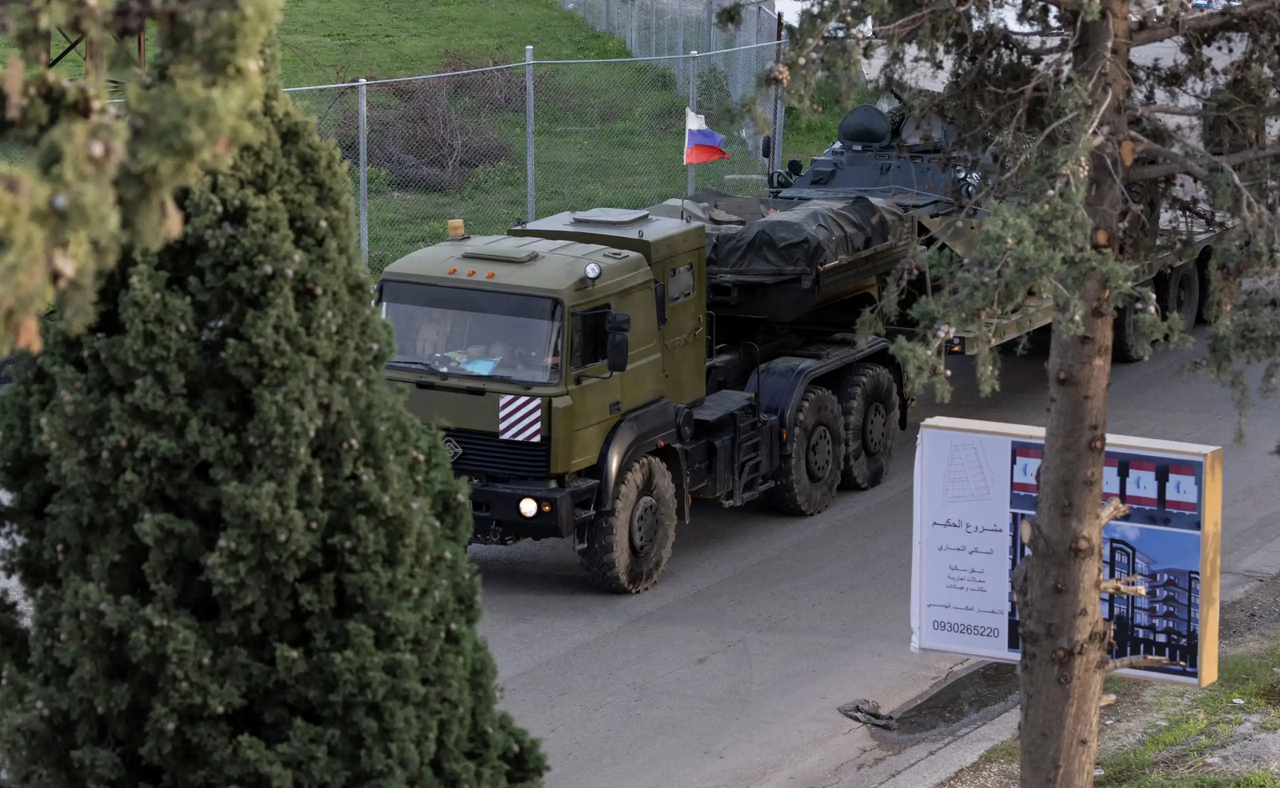 A Russian military vehicle heads towards Hmeimim air base in Syria’s coastal Latakia